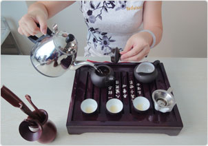 add water to the sand fired teapot